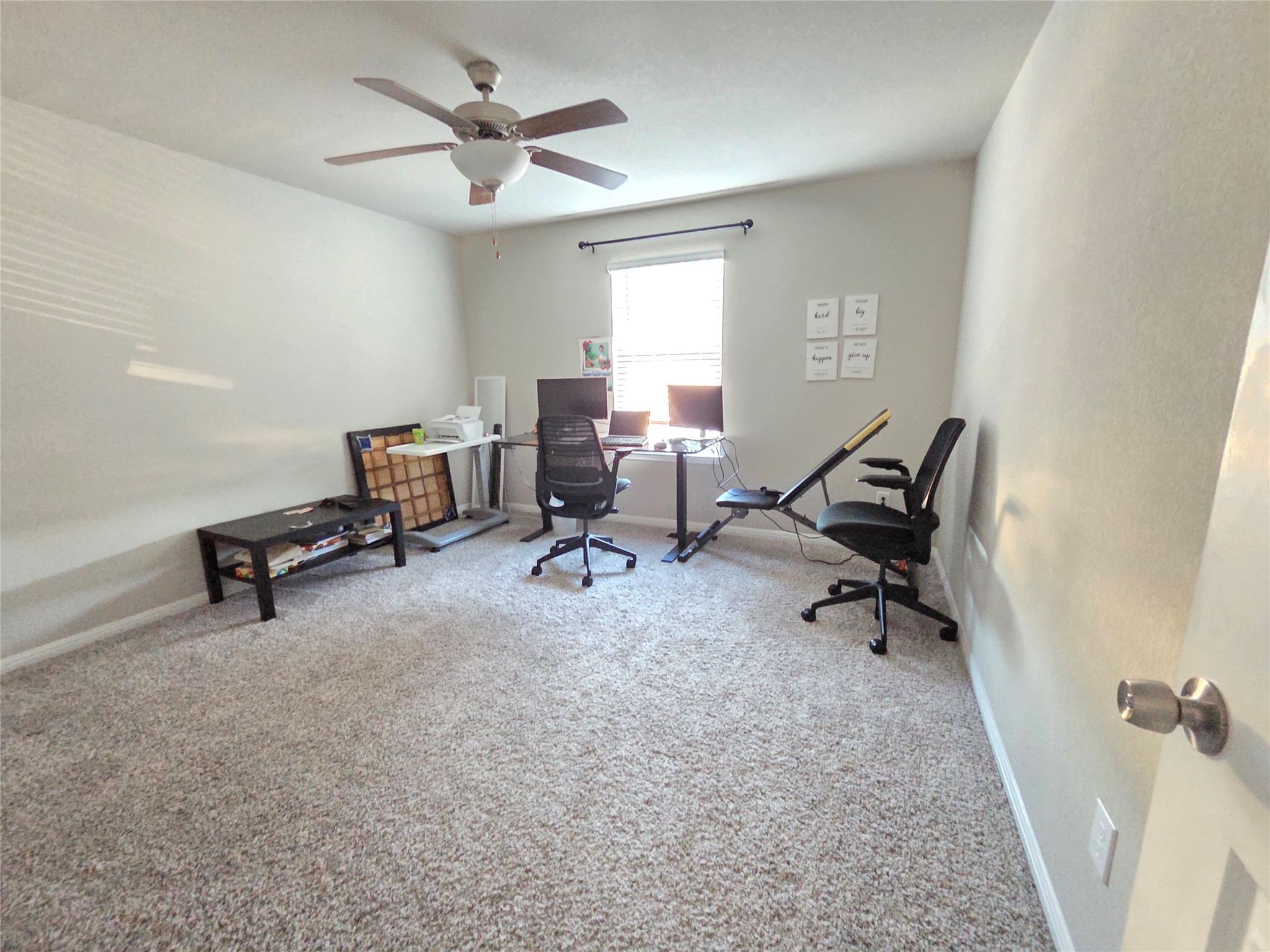 300 Windy Reed Road Hutto, TX 78634 - Photo 12 of 24 a view of a workspace with furniture and a window