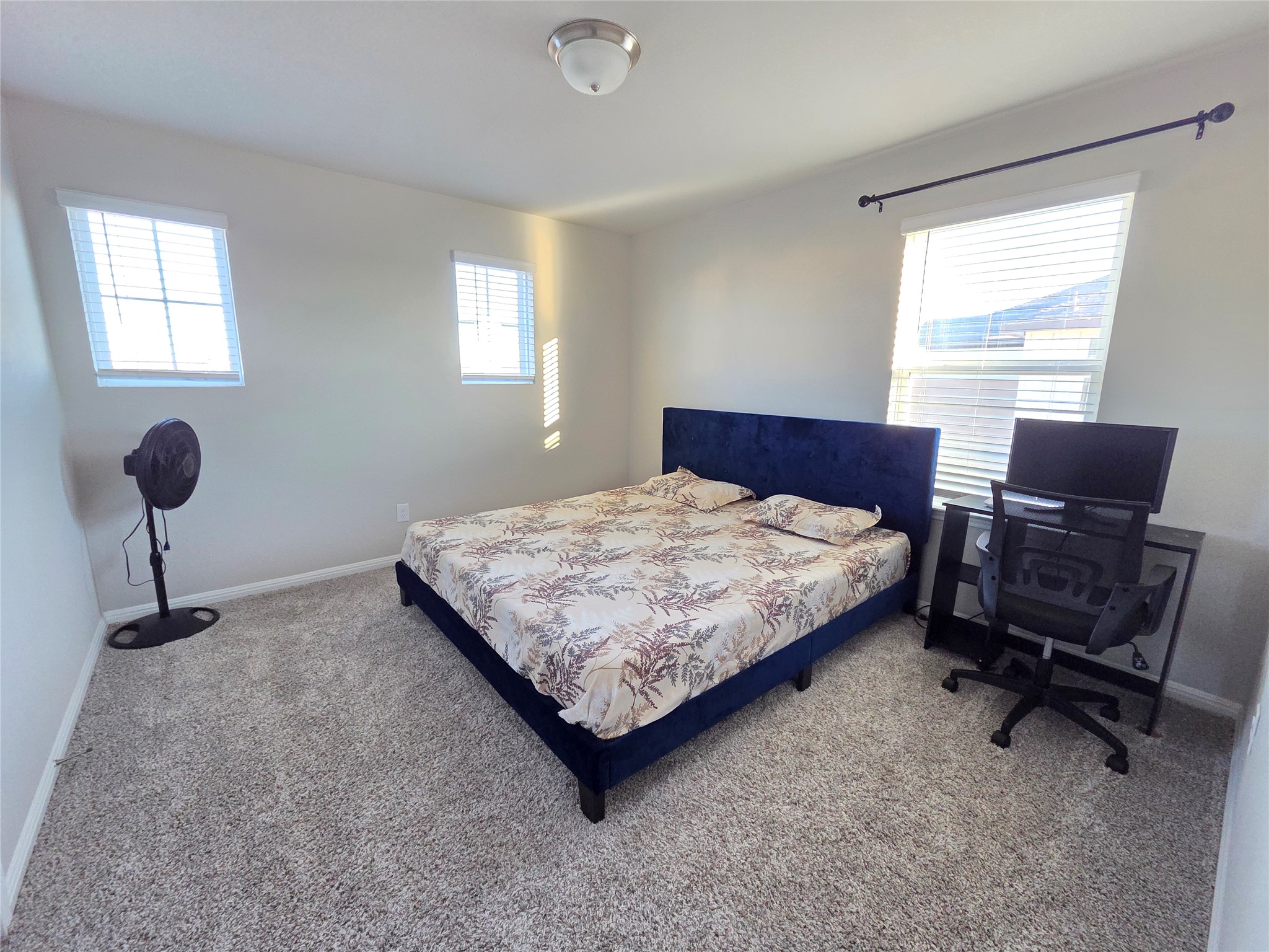 300 Windy Reed Road Hutto, TX 78634 - Photo 16 of 24 a bedroom with a bed chair and window