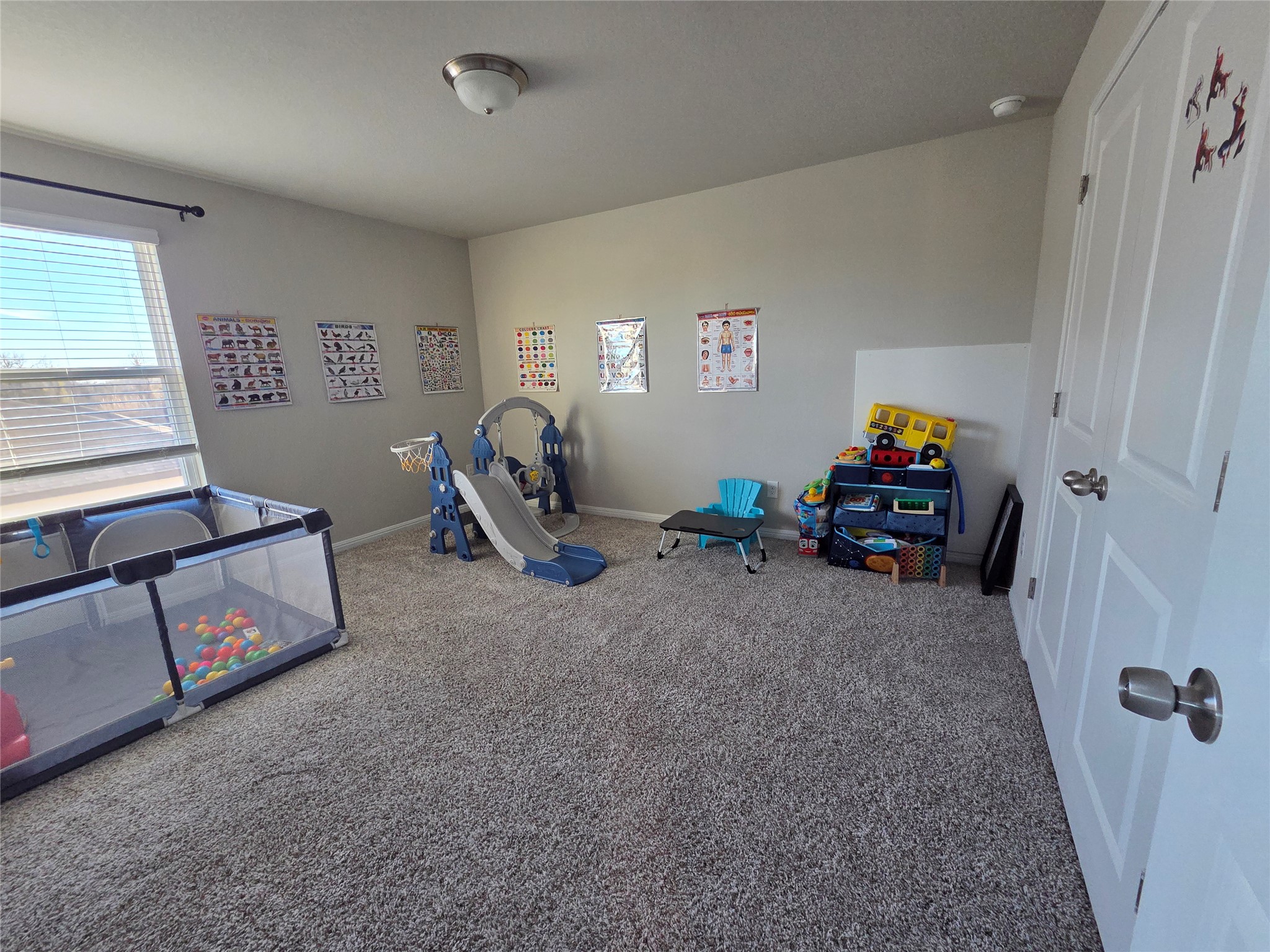 300 Windy Reed Road Hutto, TX 78634 - Photo 17 of 24 a view of a room with baby toys