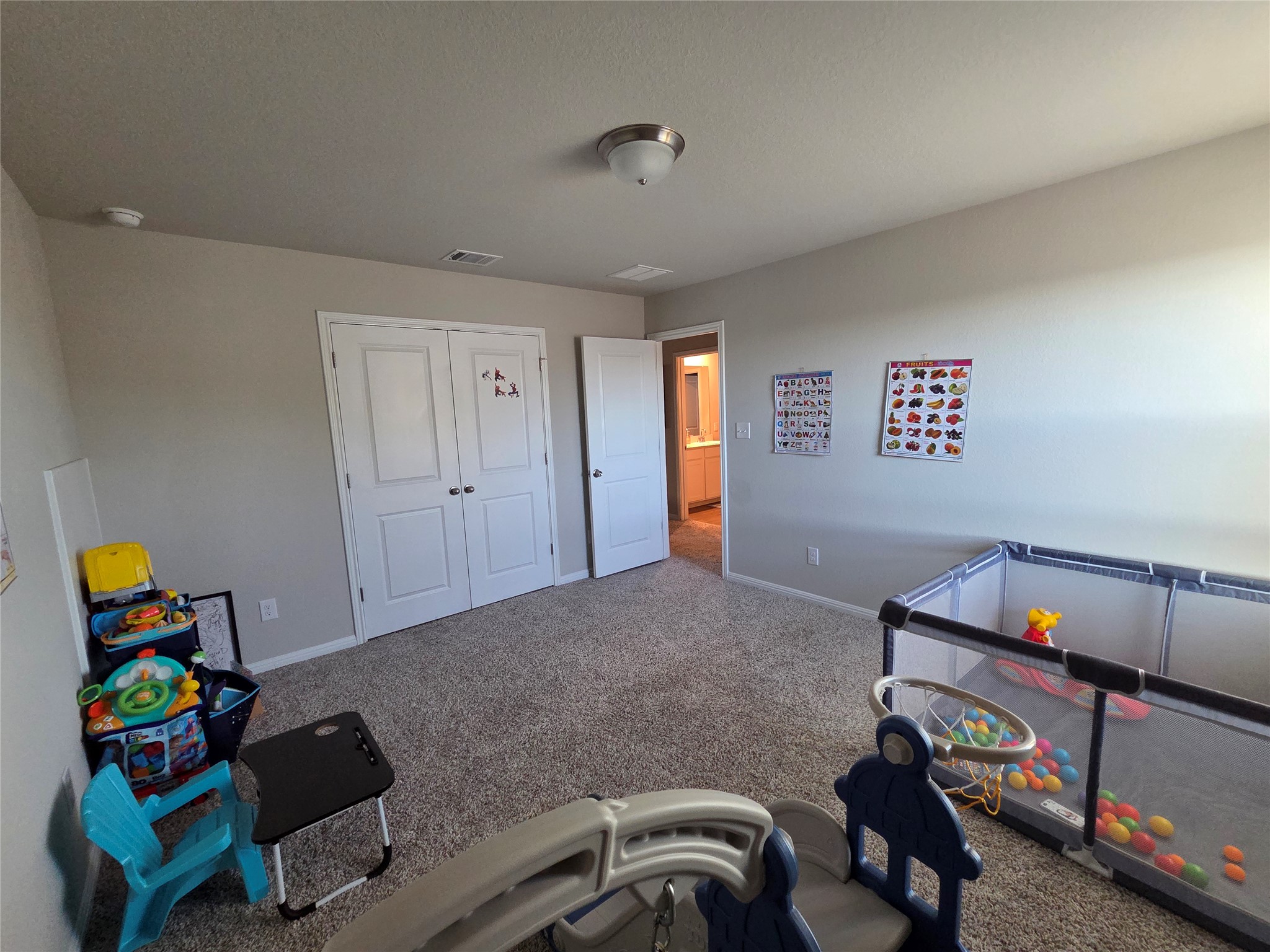 300 Windy Reed Road Hutto, TX 78634 - Photo 18 of 24 a living room with baby toys