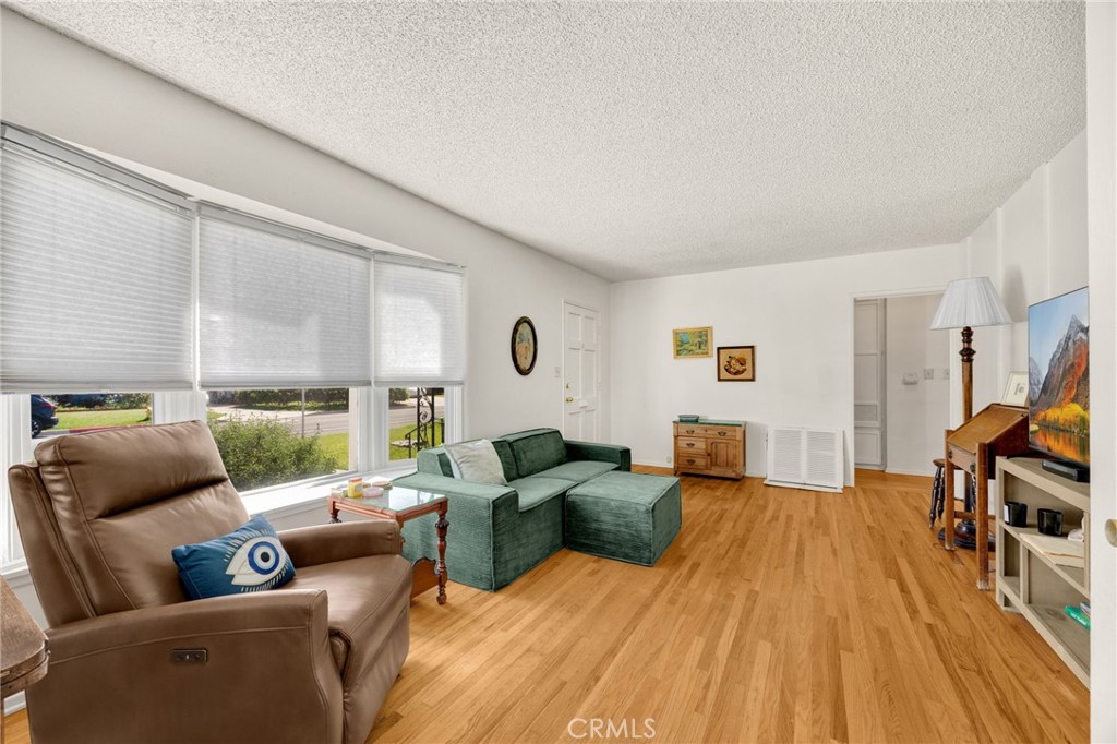 4577 Ranger Avenue El Monte, CA 91731 - Photo 9 of 25 a living room with furniture and a wooden floor