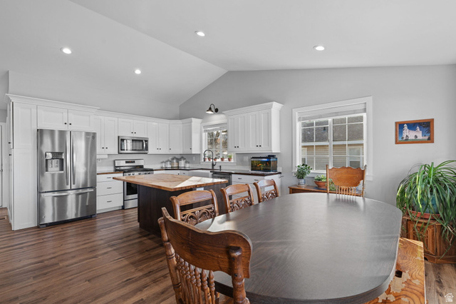 75 North 100th Street West Fillmore, UT 84631 - Photo 2 of 62 Dining room featuring dark wood-style floors, vaulted ceiling, and recessed lighting