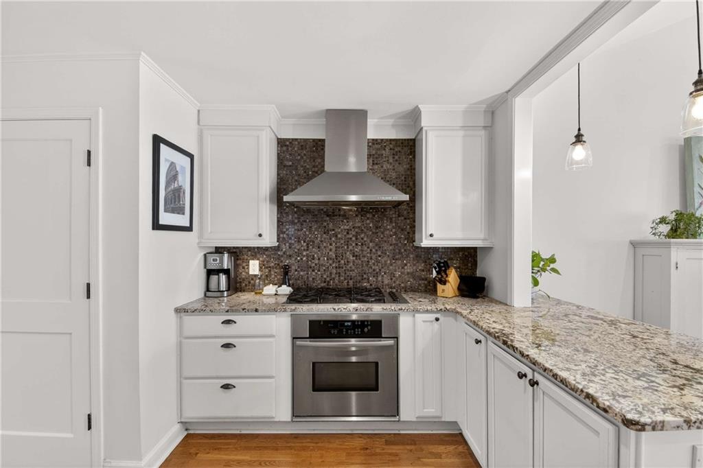 760 Scott Circle Decatur, GA 30033 - Photo 11 of 48 a kitchen with stainless steel appliances granite countertop a stove and a sink