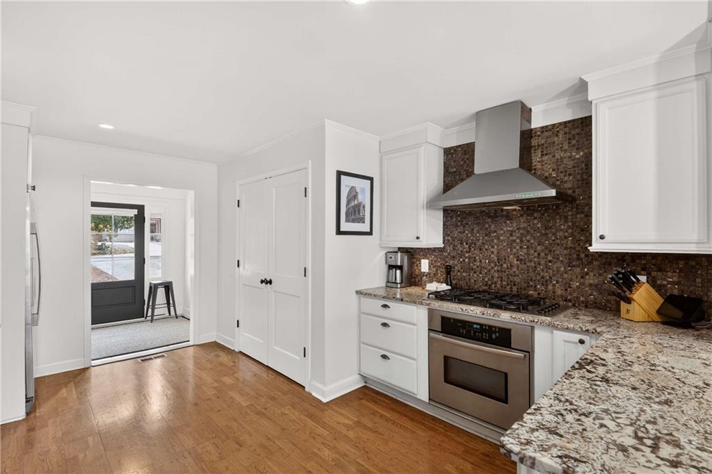 760 Scott Circle Decatur, GA 30033 - Photo 12 of 48 a kitchen with stainless steel appliances a stove a sink and a refrigerator