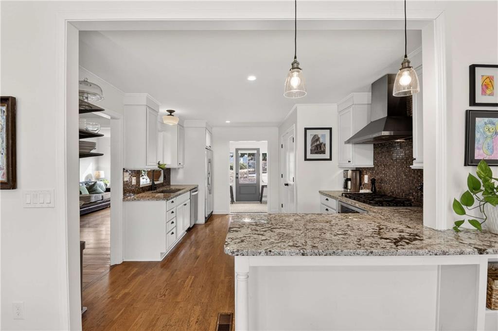 760 Scott Circle Decatur, GA 30033 - Photo 13 of 48 a large kitchen with granite countertop a large counter top space appliances and cabinets