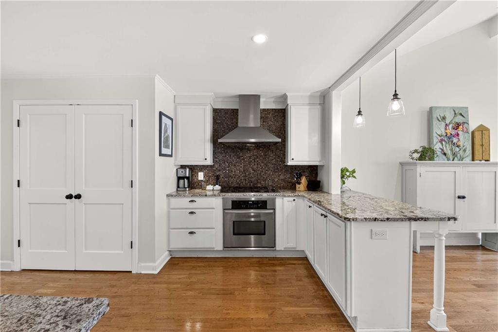 760 Scott Circle Decatur, GA 30033 - Photo 15 of 48 a kitchen with stainless steel appliances granite countertop a stove sink and cabinets
