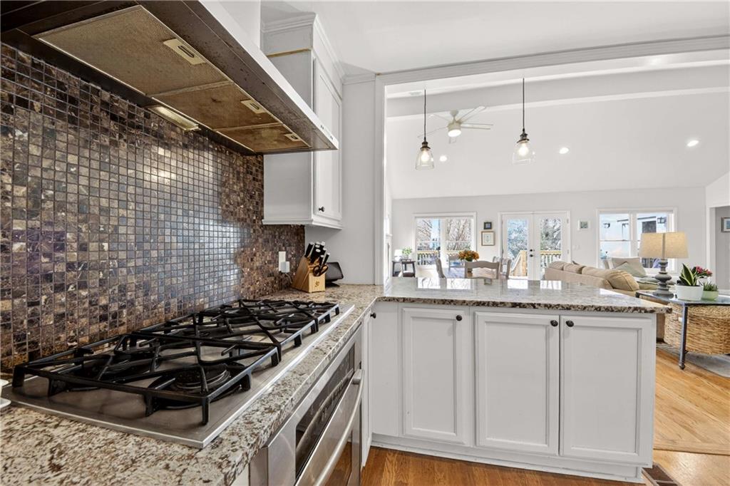 760 Scott Circle Decatur, GA 30033 - Photo 16 of 48 a kitchen with granite countertop a stove and a sink
