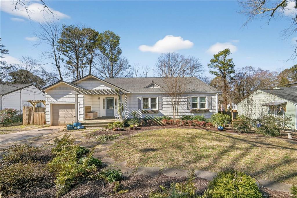 760 Scott Circle Decatur, GA 30033 - Photo 2 of 48 a front view of a house with a yard