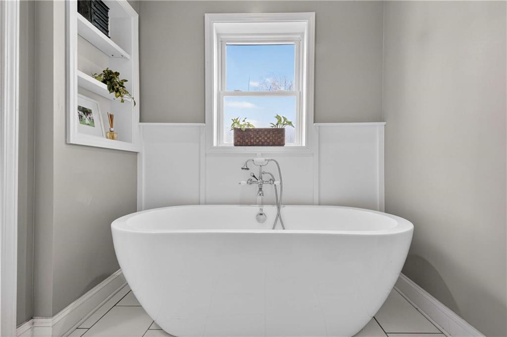 760 Scott Circle Decatur, GA 30033 - Photo 27 of 48 a white bath tub sitting in a bathroom