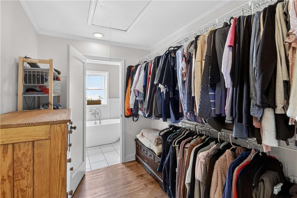 760 Scott Circle Decatur, GA 30033 - Photo 29 of 48 a view of walk in closet with clothes and shoes