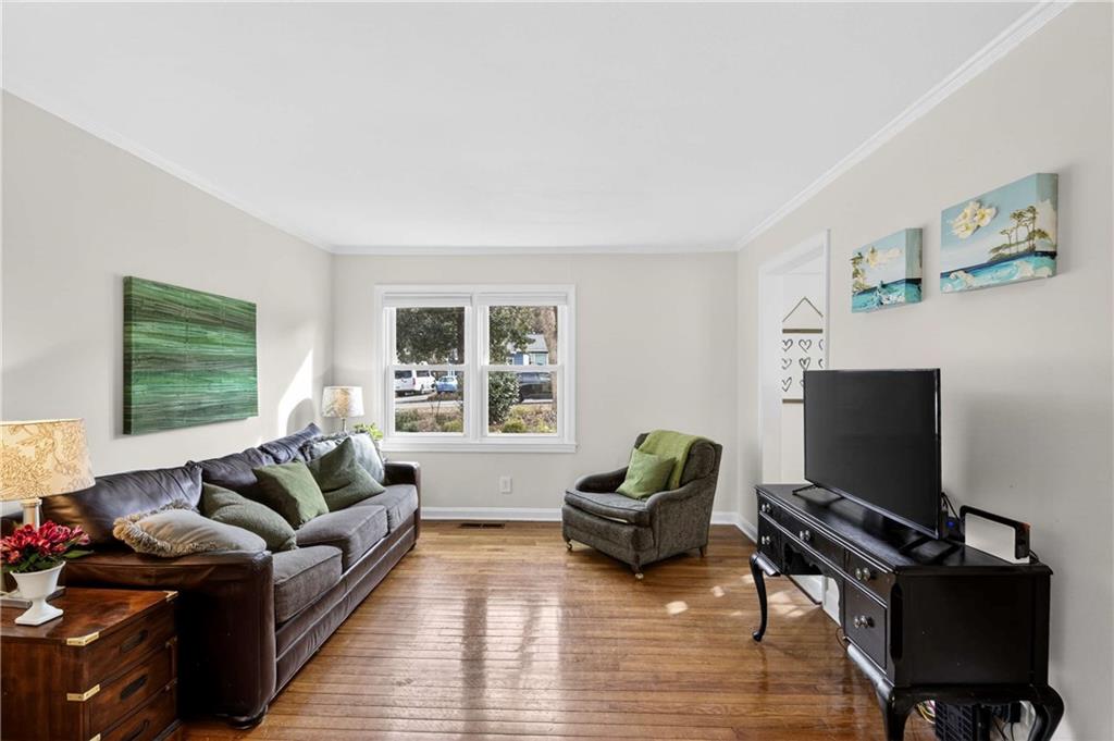 760 Scott Circle Decatur, GA 30033 - Photo 7 of 48 a living room with furniture flat screen tv and a large window