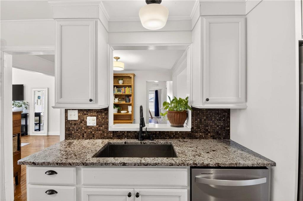 760 Scott Circle Decatur, GA 30033 - Photo 10 of 48 a kitchen with granite countertop a sink a stove and cabinets