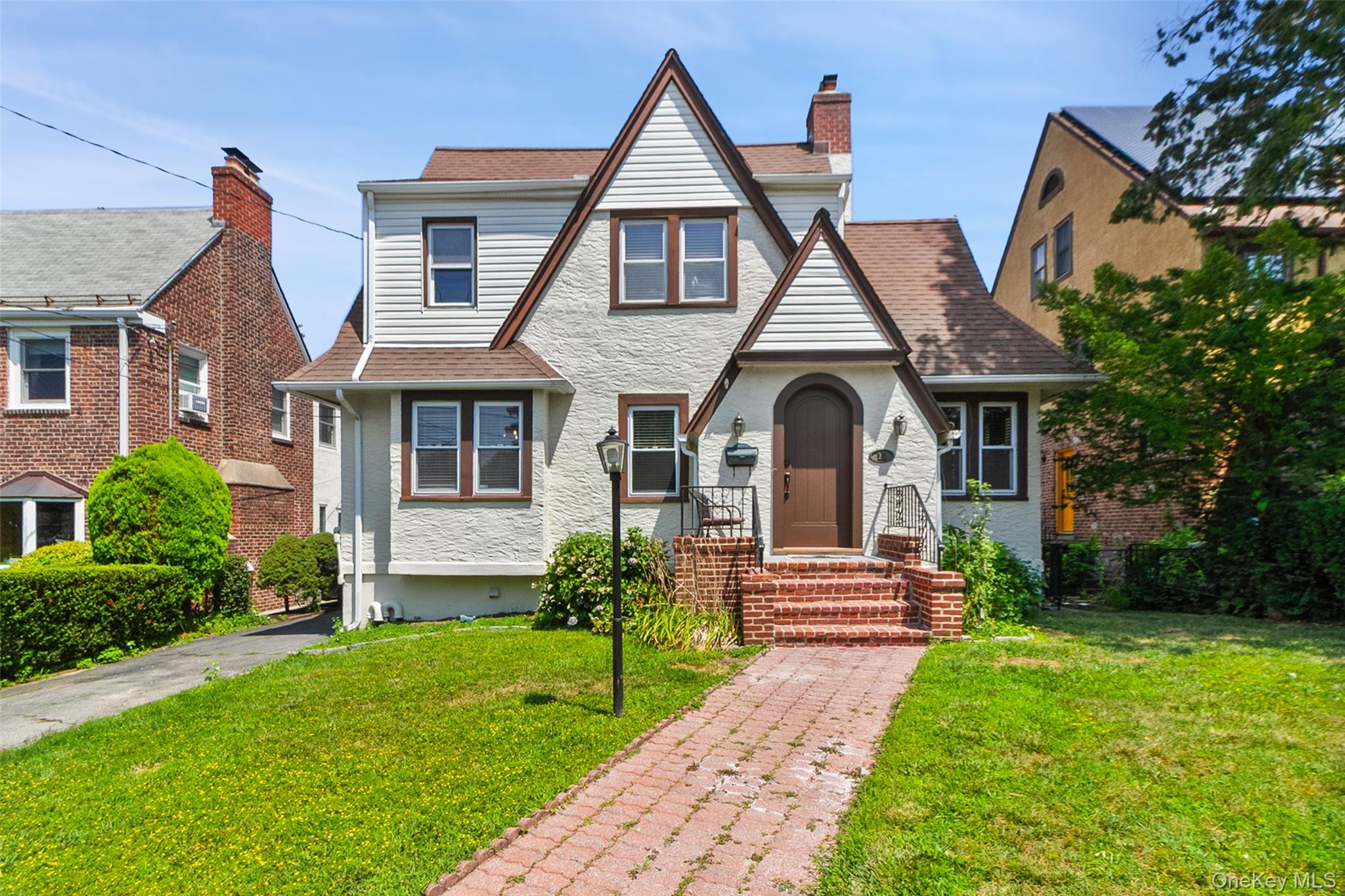 11 Crawford Street Yonkers, NY 10705 - Photo 1 of 24 Tudor house featuring a front lawn and roof with shingles