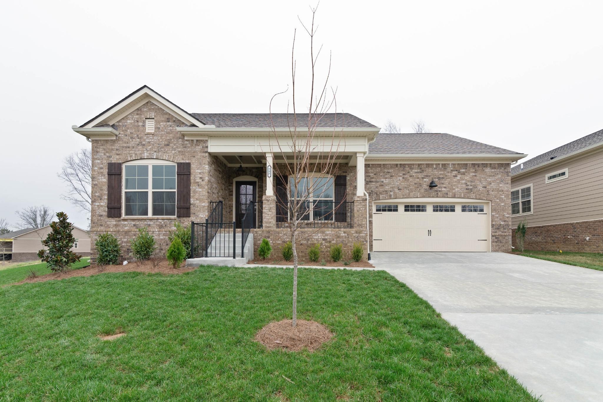 647 Castle Road Mount Juliet, TN 37122 - Photo 1 of 11 a front view of a house with a yard and garage