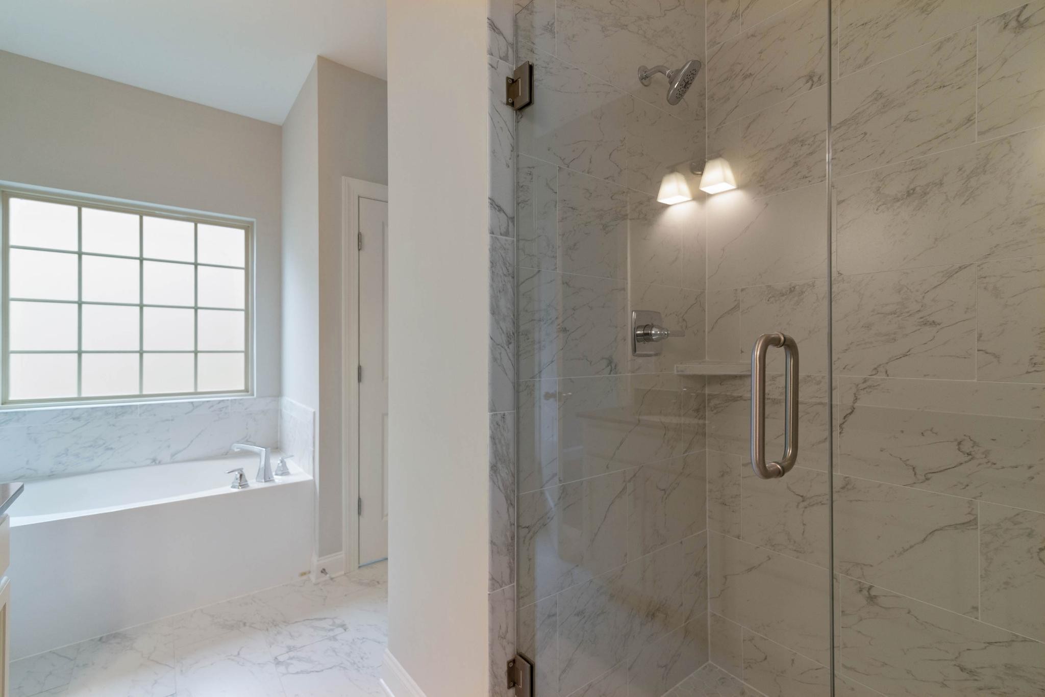 647 Castle Road Mount Juliet, TN 37122 - Photo 7 of 11 a bathroom with a bathtub and shower