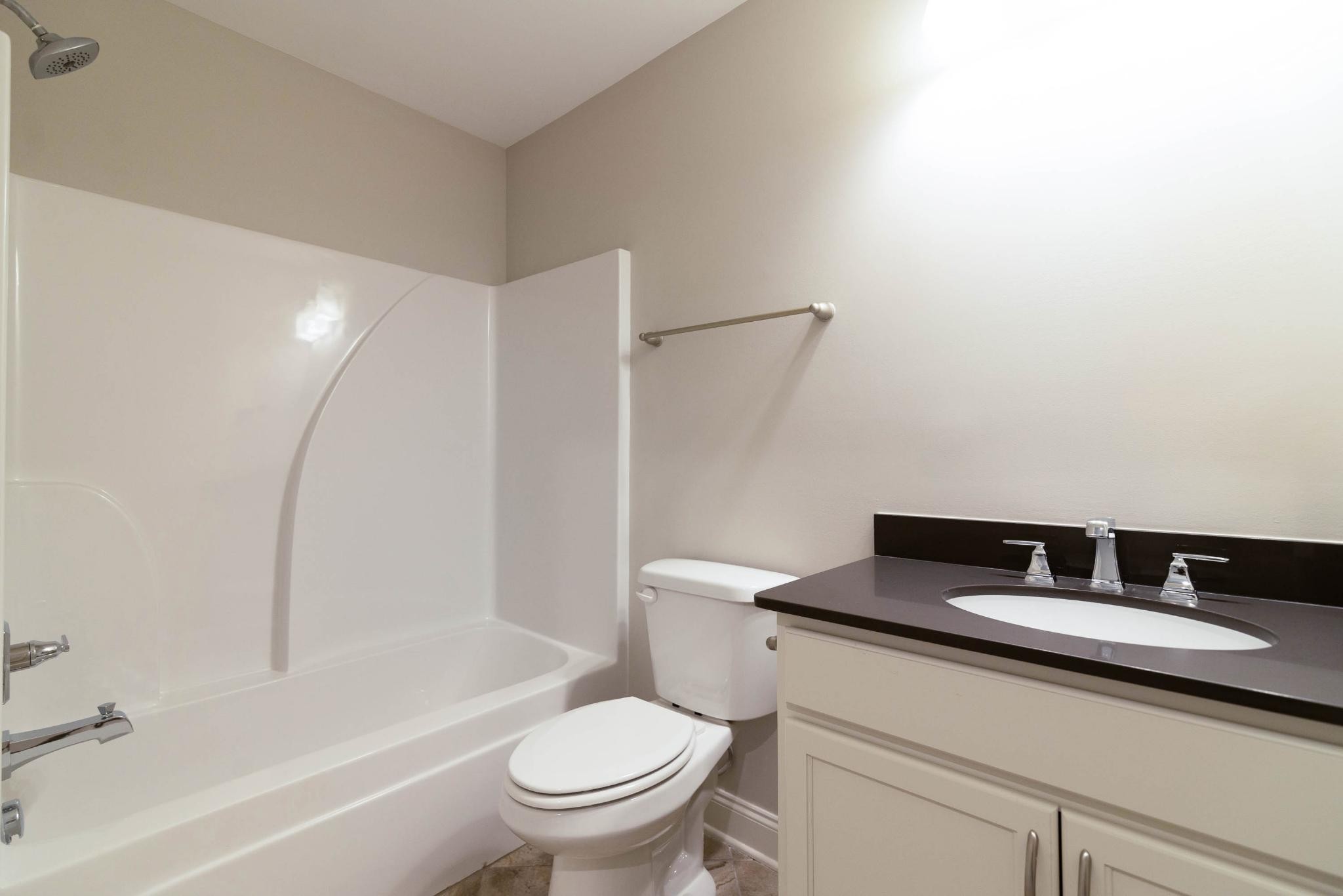 647 Castle Road Mount Juliet, TN 37122 - Photo 9 of 11 a bathroom with a granite countertop sink toilet and shower