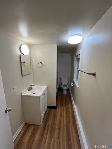 a view of a hallway with a sink