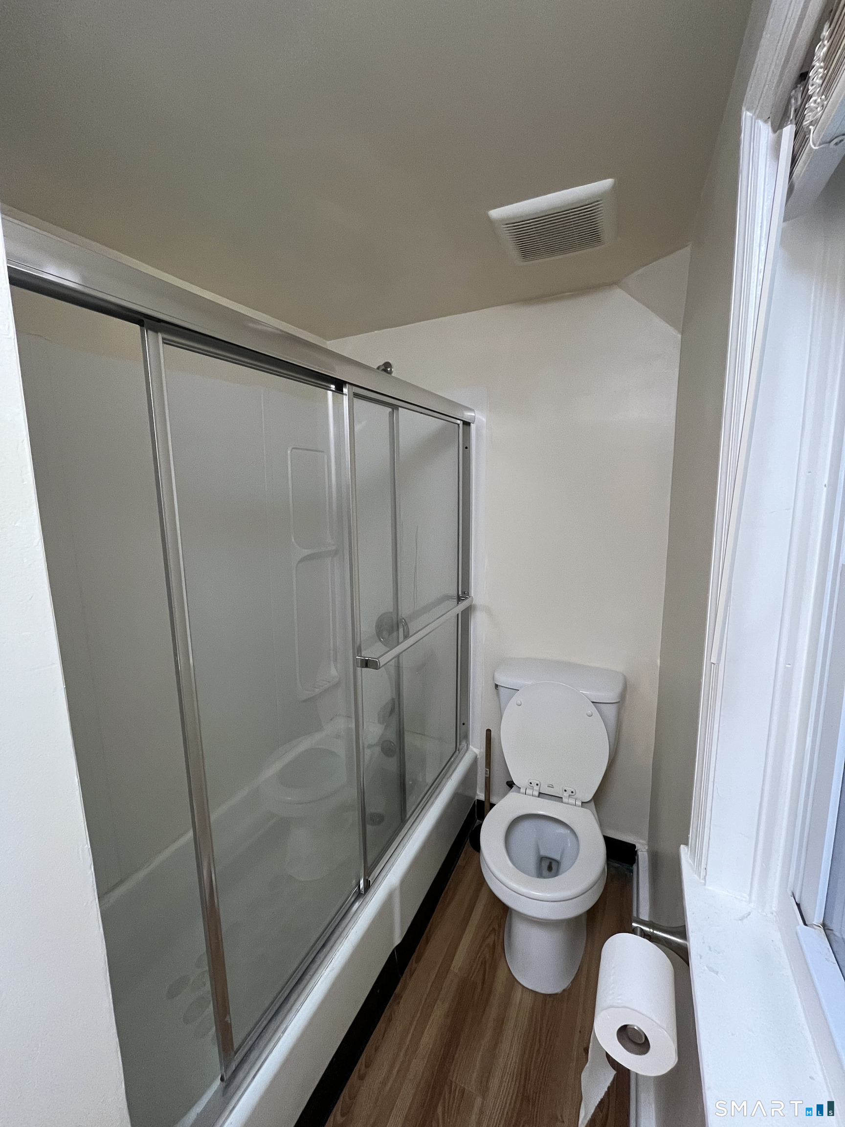 6 Pleasant Street, Unit 3 Norwalk, CT 06855 - Photo 12 of 16 a white toilet sitting next to a shower