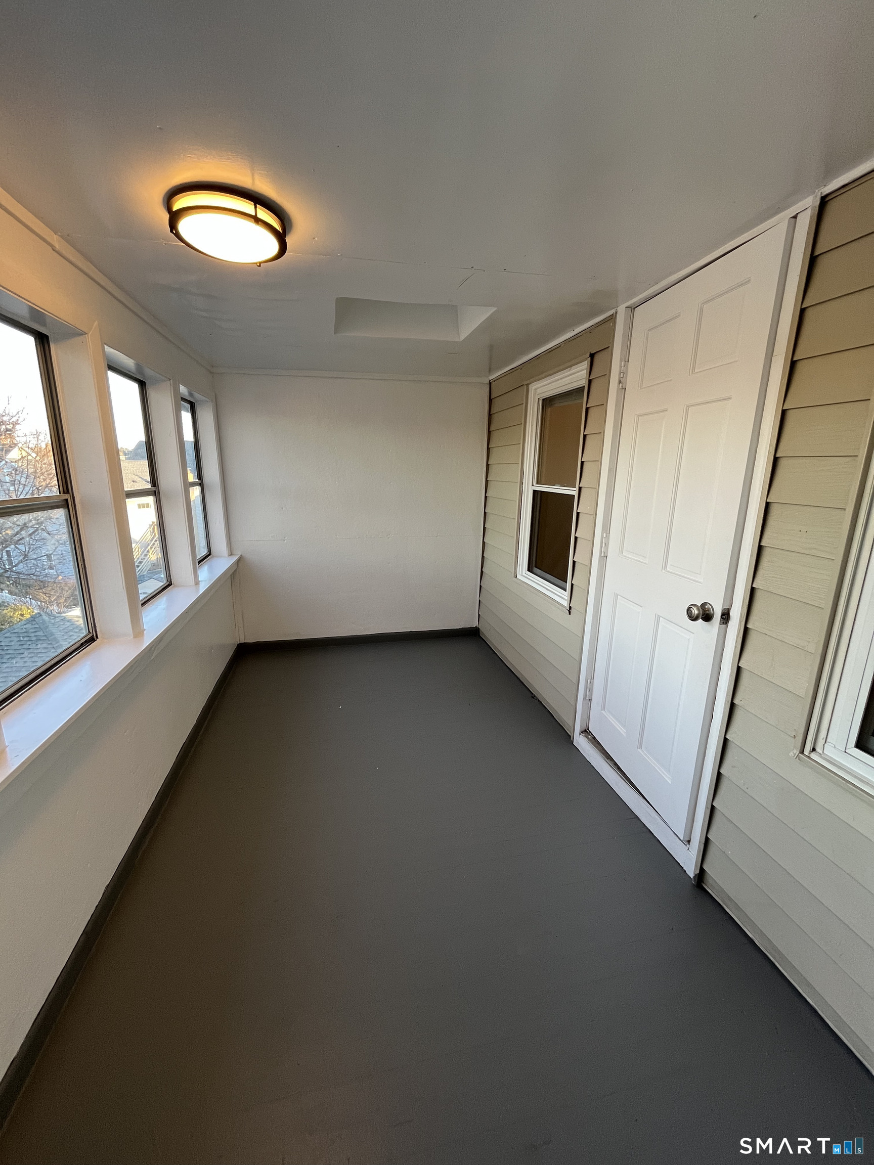 6 Pleasant Street, Unit 3 Norwalk, CT 06855 - Photo 13 of 16 an empty room with windows