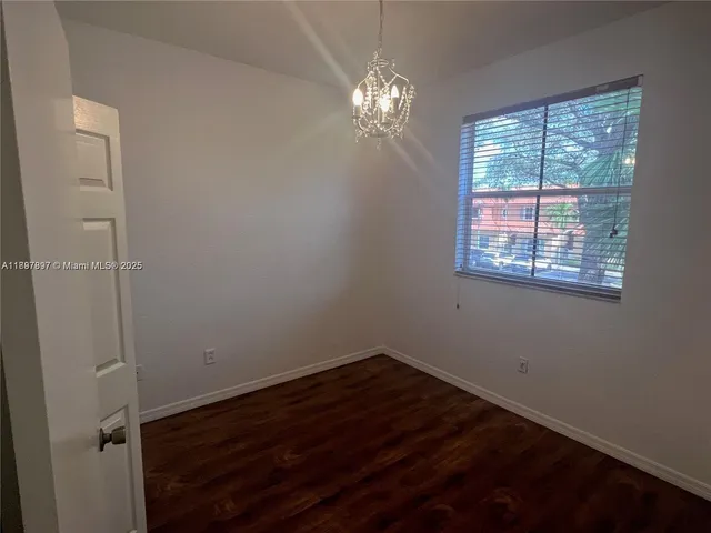 a view of a room that has a window in it