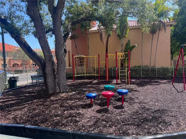 a view of a backyard with a table and chair