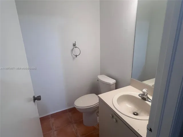 a bathroom with a sink and toilet