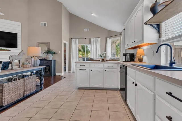 a kitchen with stainless steel appliances a stove microwave and cabinets