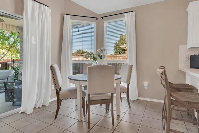 a kitchen with stainless steel appliances a sink dishwasher stove refrigerator and cabinets