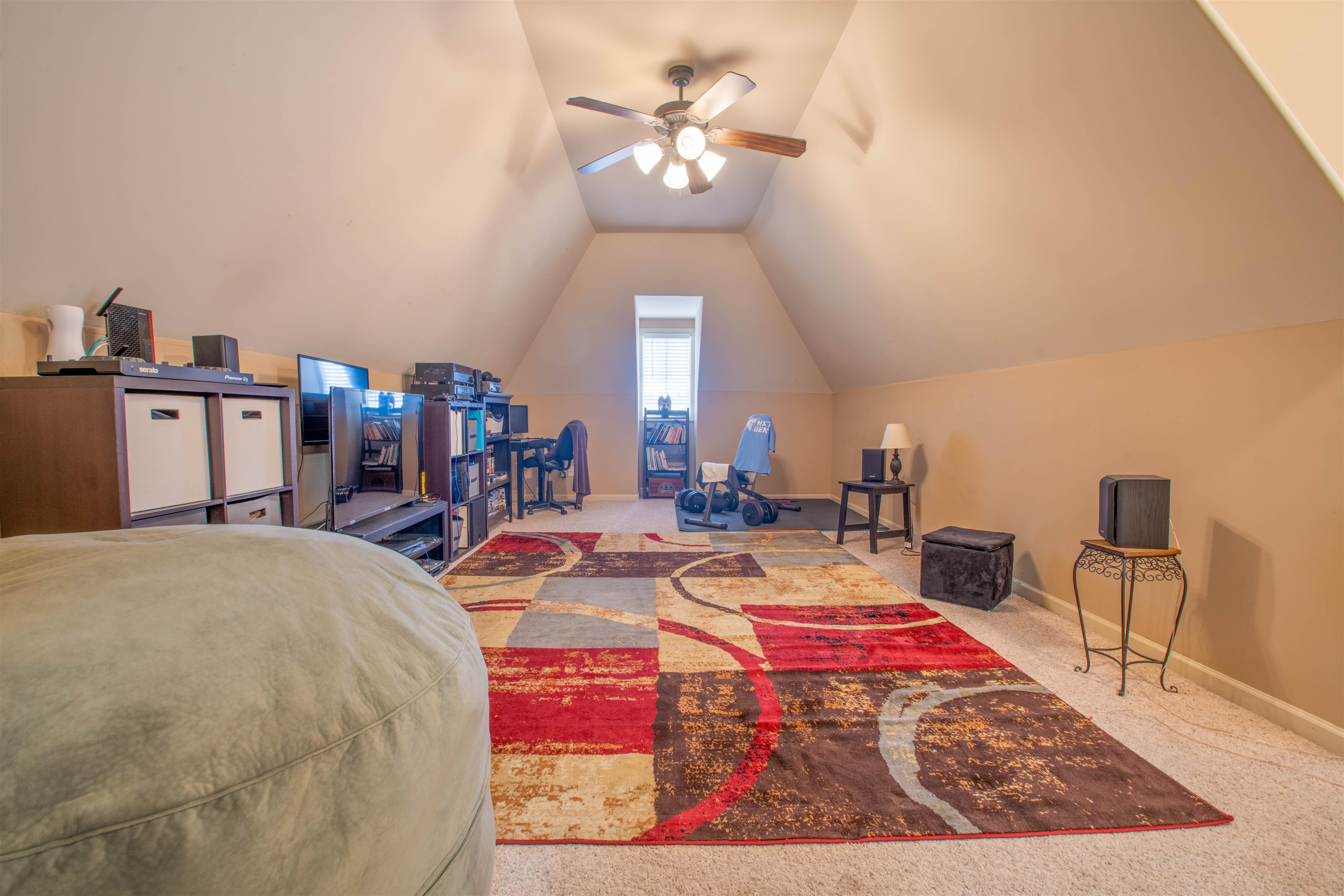 8722 Brunswick Forest Drive Bartlett, TN 38133 - Photo 24 of 38 Bonus Room featuring vaulted ceiling, carpet flooring, and ceiling fan