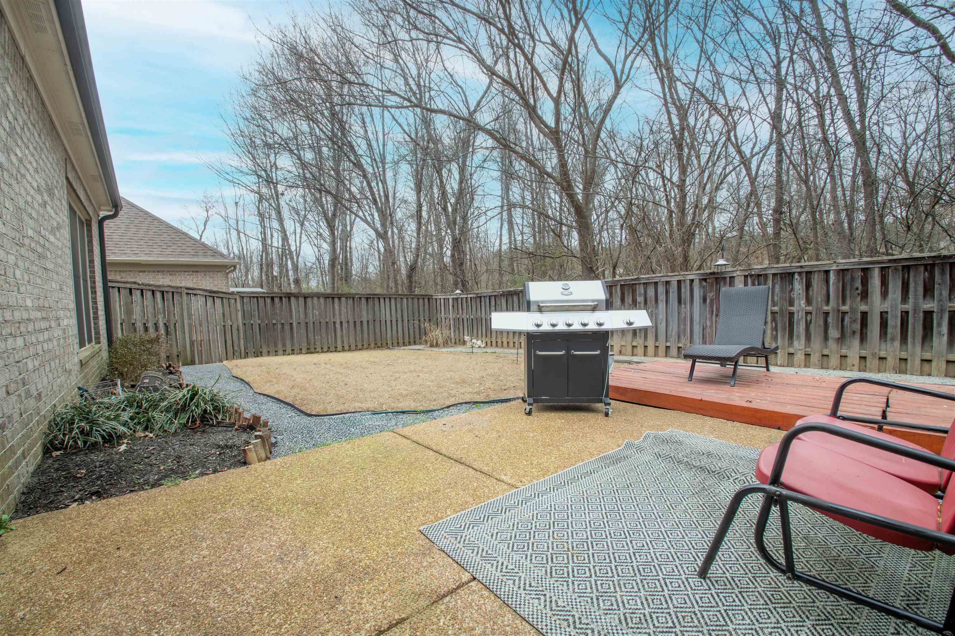 8722 Brunswick Forest Drive Bartlett, TN 38133 - Photo 32 of 38 View of patio featuring area for grilling and a deck