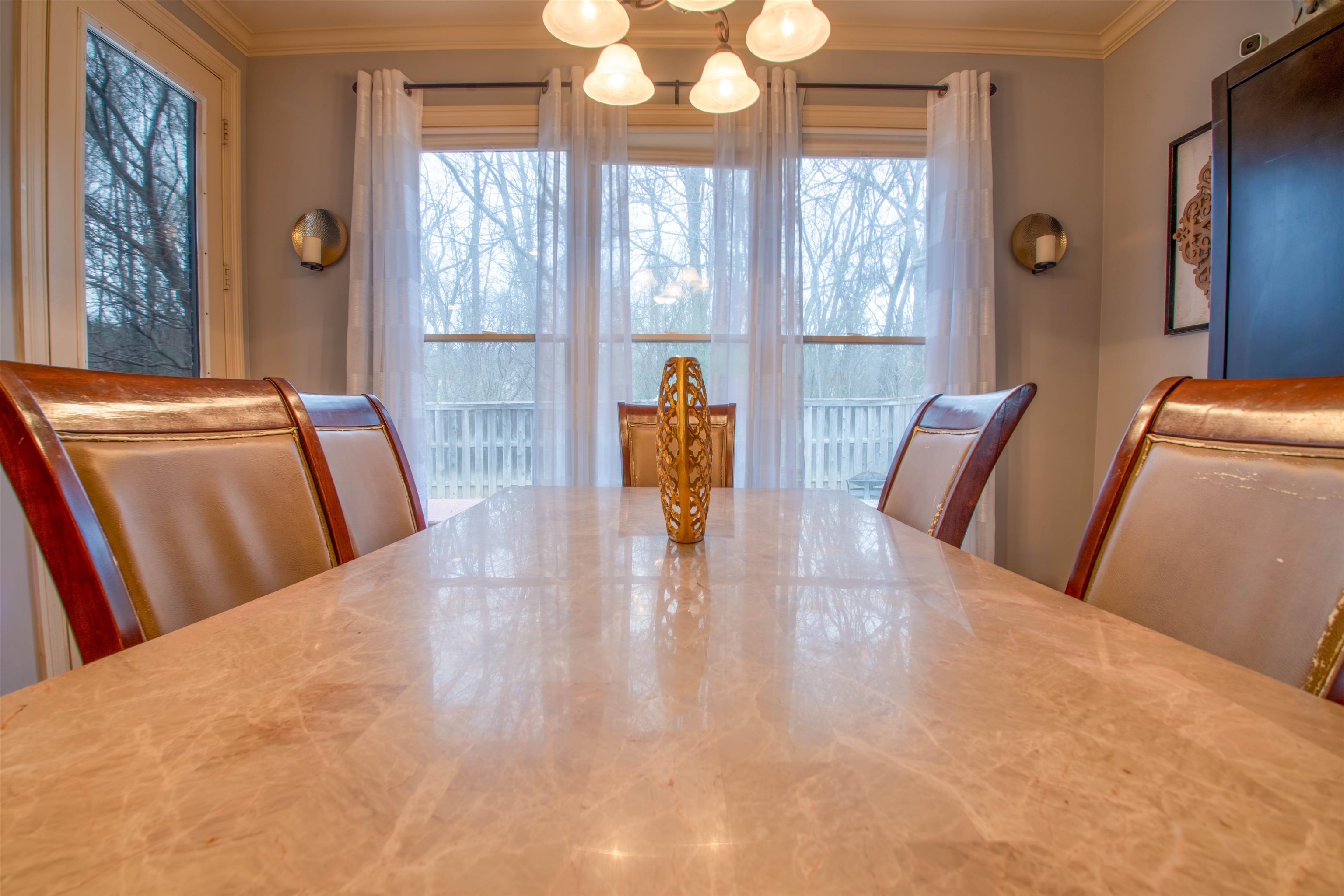 8722 Brunswick Forest Drive Bartlett, TN 38133 - Photo 10 of 38 Elegant dining space with abundant natural light and serene outdoor views.