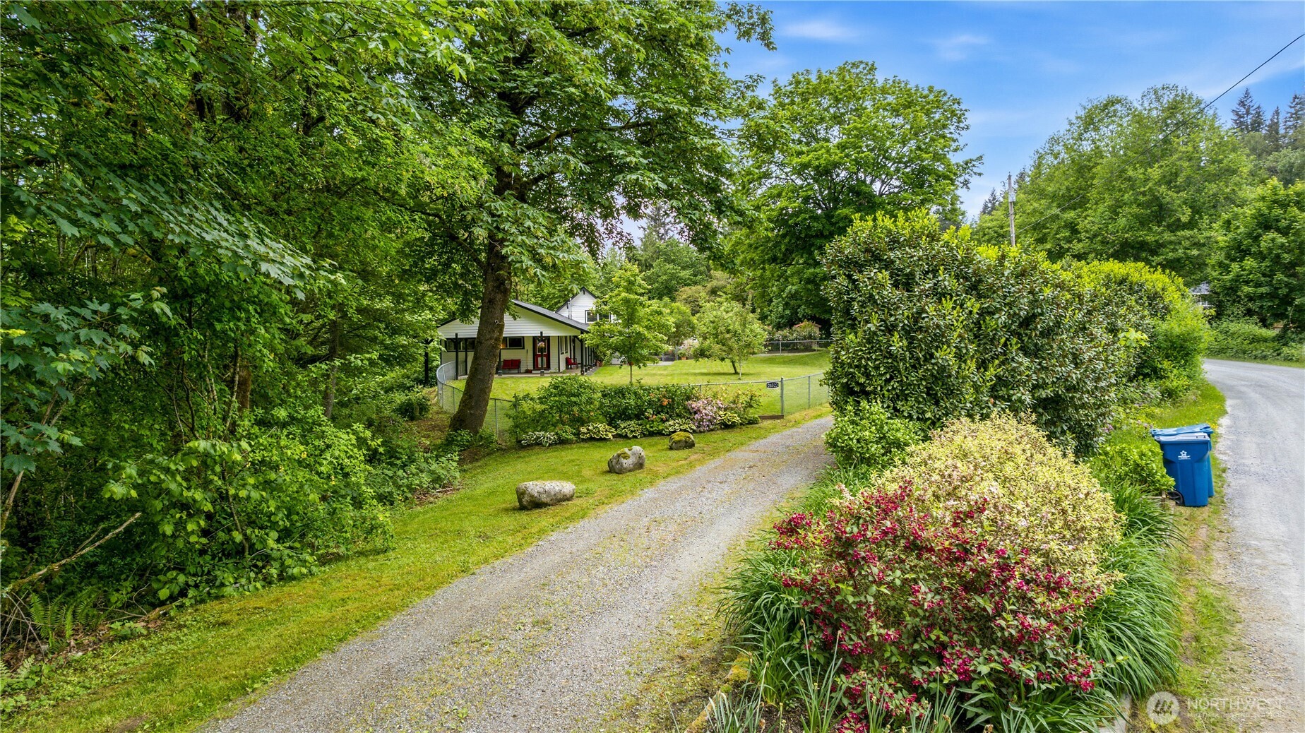 24522 Cromwell Road Monroe, WA 98272 - Photo 37 of 40 a view of a garden with plants and large trees