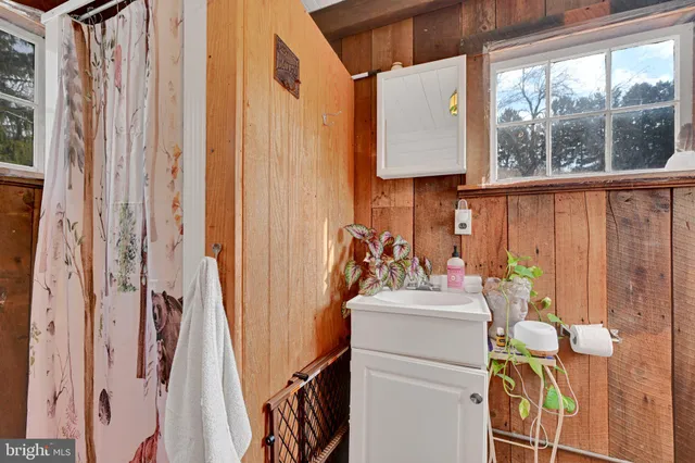 a utility room with dryer washer and a window