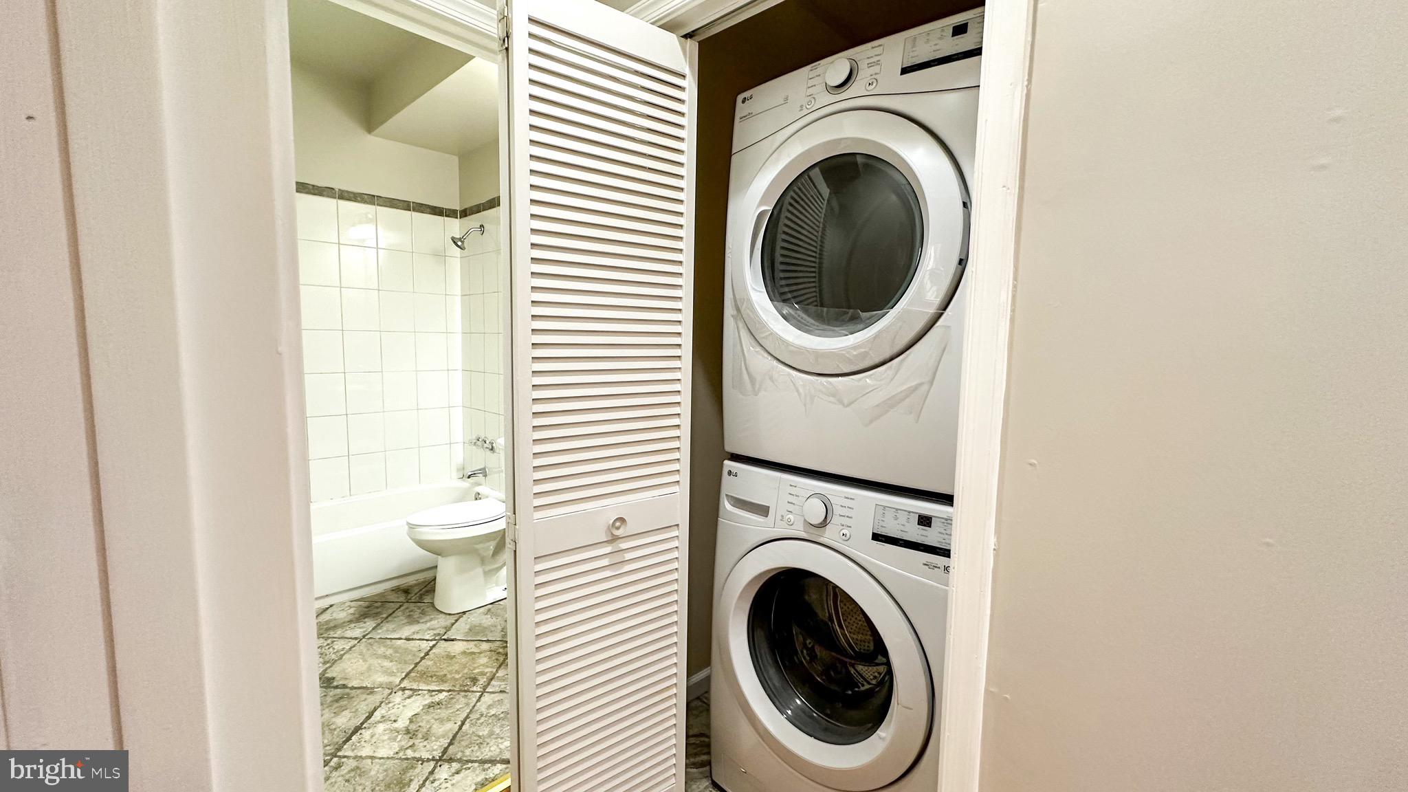 3408 Sherman Avenue Northwest, Unit 101 Washington, DC 20010 - Photo 14 of 15 a utility room with dryer and washer
