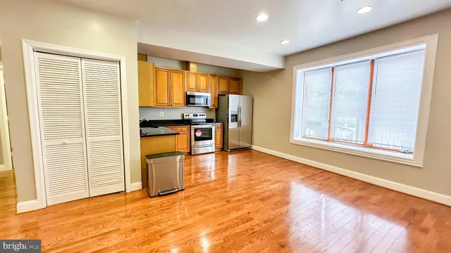a view of a kitchen with a sink and a window