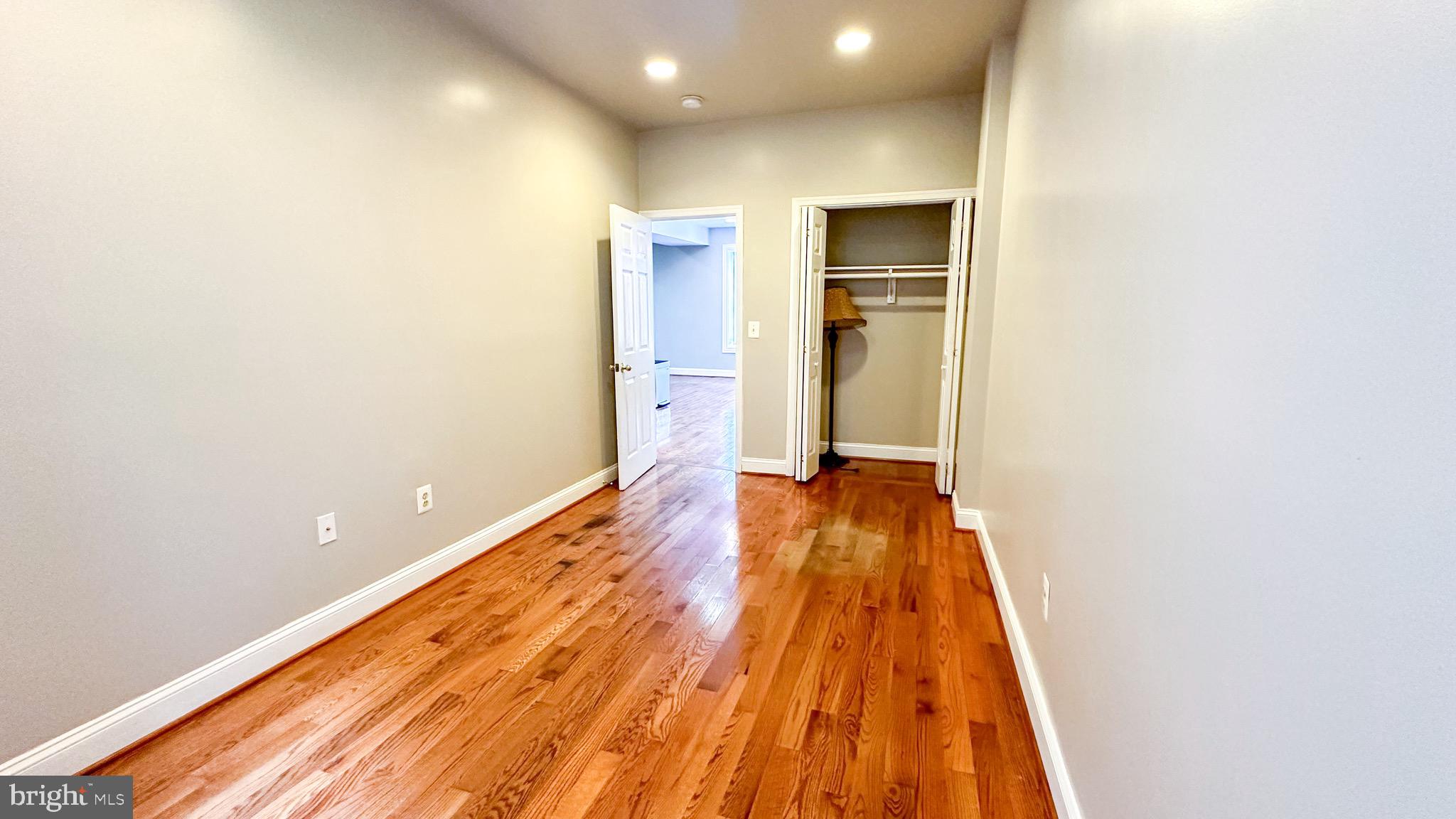 3408 Sherman Avenue Northwest, Unit 101 Washington, DC 20010 - Photo 9 of 15 a view of a room with wooden floor and staircase