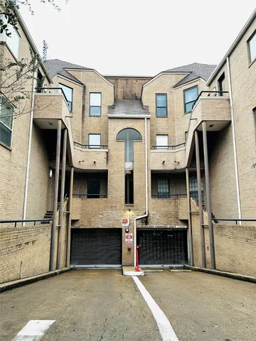 a view of a white house with a large windows