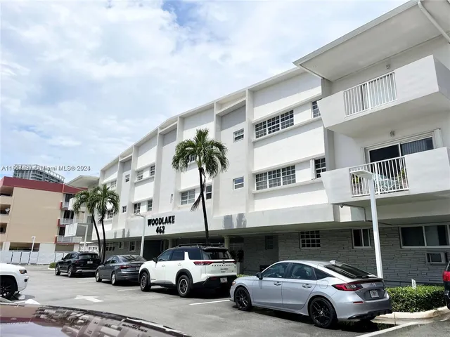 a front view of a building with parking space