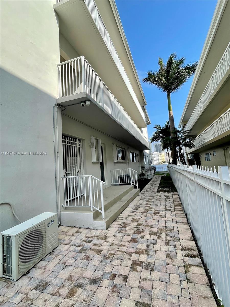 462 Golden Isles Drive, Unit 210 Hallandale Beach, FL 33009 - Photo 22 of 41 a view of stairs and patio