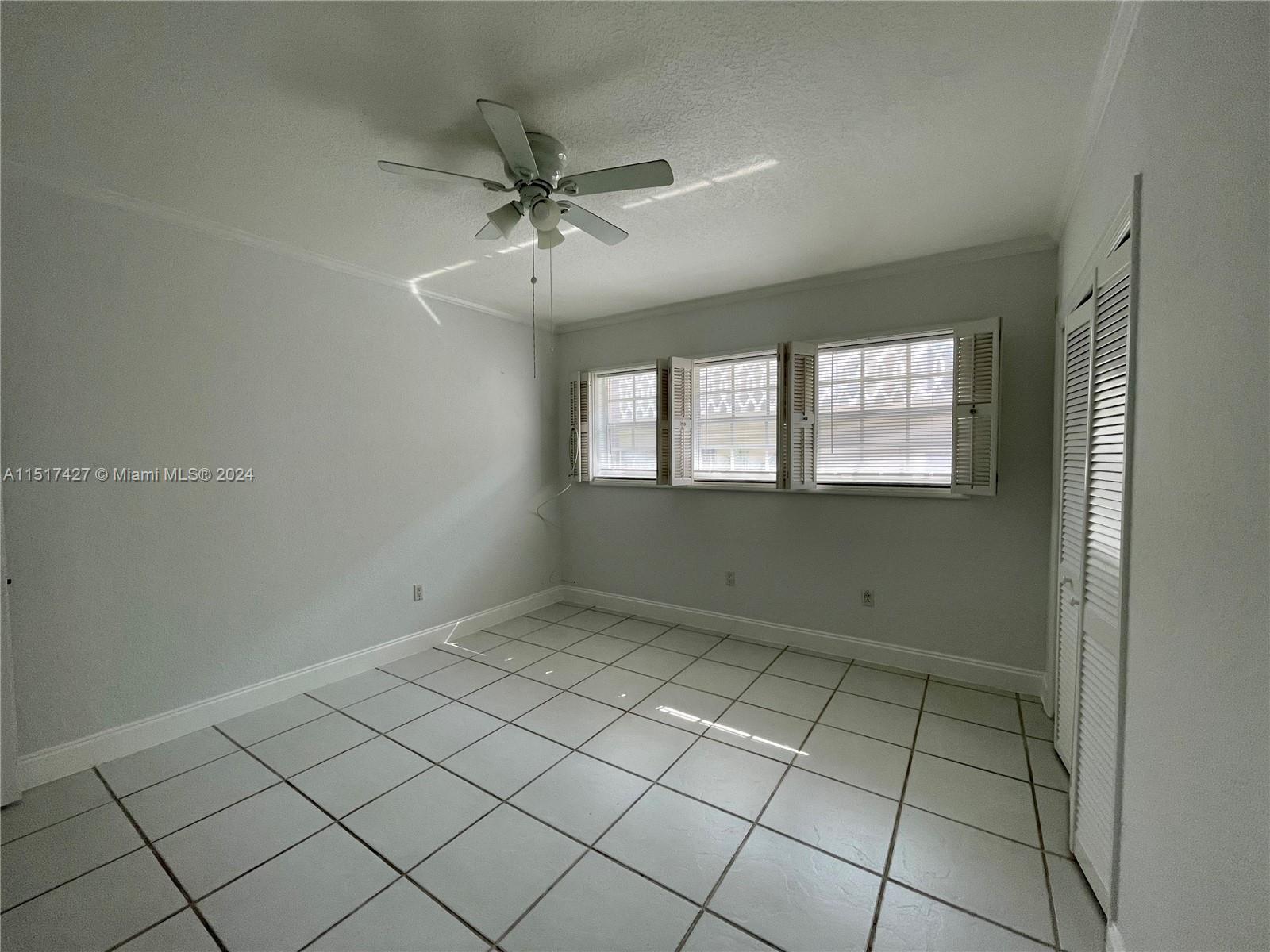 462 Golden Isles Drive, Unit 210 Hallandale Beach, FL 33009 - Photo 29 of 41 a view of an empty room and window
