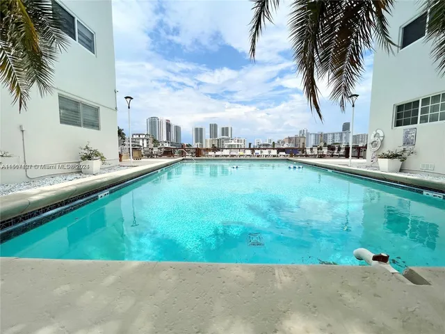 a view of a swimming pool and a chair