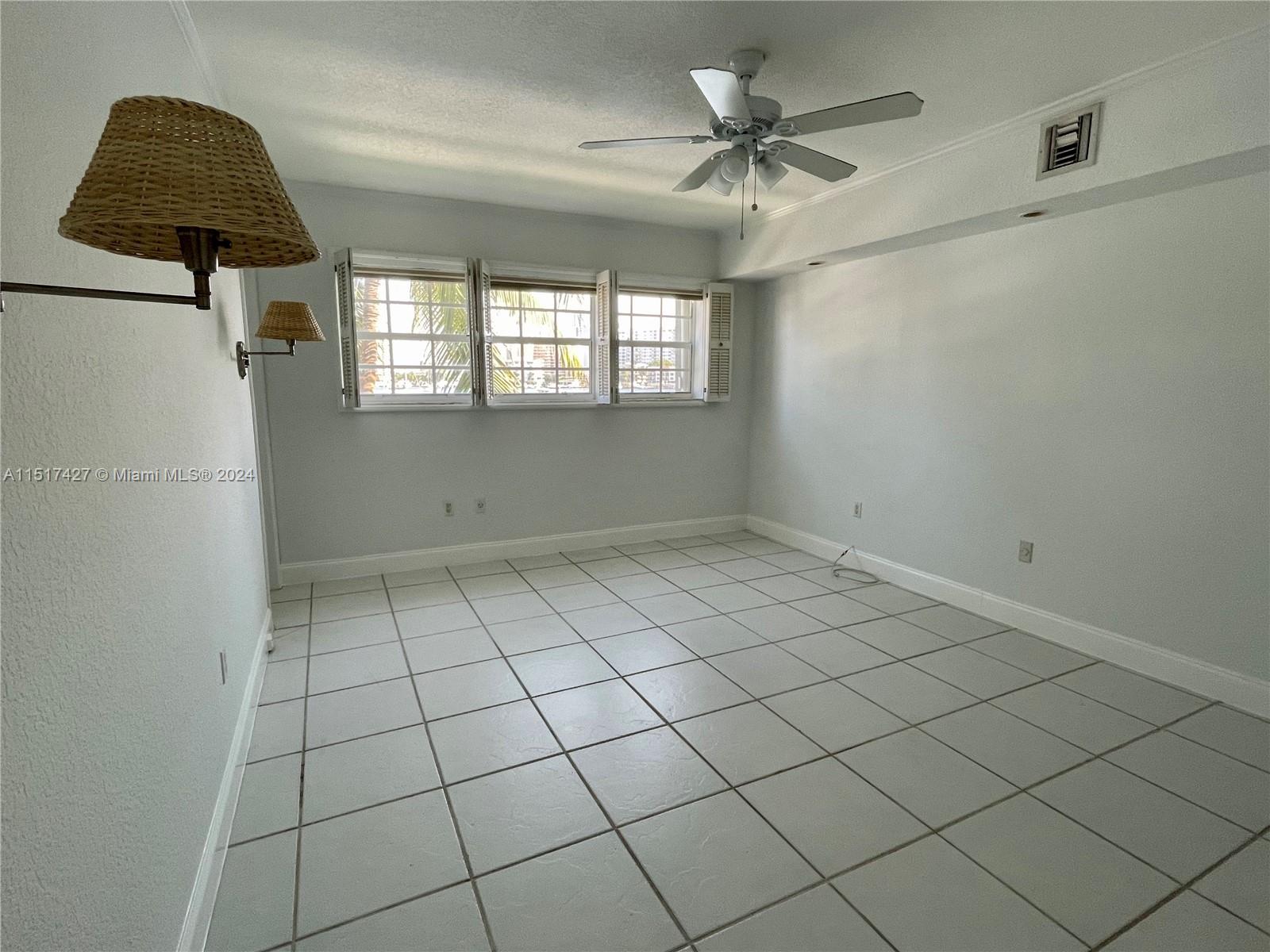 462 Golden Isles Drive, Unit 210 Hallandale Beach, FL 33009 - Photo 37 of 41 a view of an empty room and window