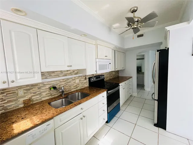 $415,000 | 462 Golden Isles Drive, Unit 210, Hallandale Beach, FL 33009