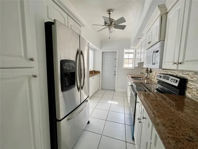 $415,000 | 462 Golden Isles Drive, Unit 210, Hallandale Beach, FL 33009