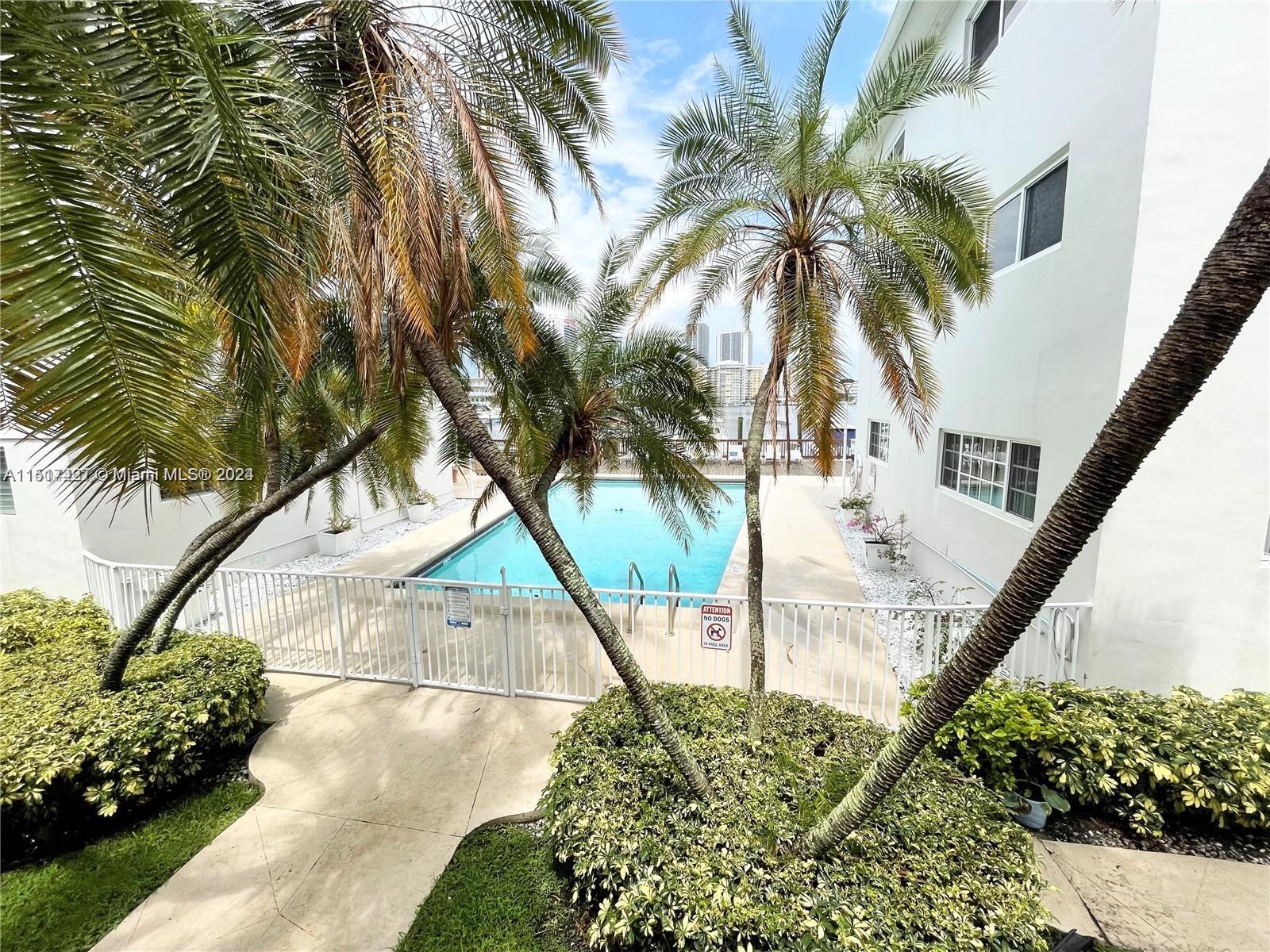 462 Golden Isles Drive, Unit 210 Hallandale Beach, FL 33009 - Photo 6 of 41 a view of backyard of the house