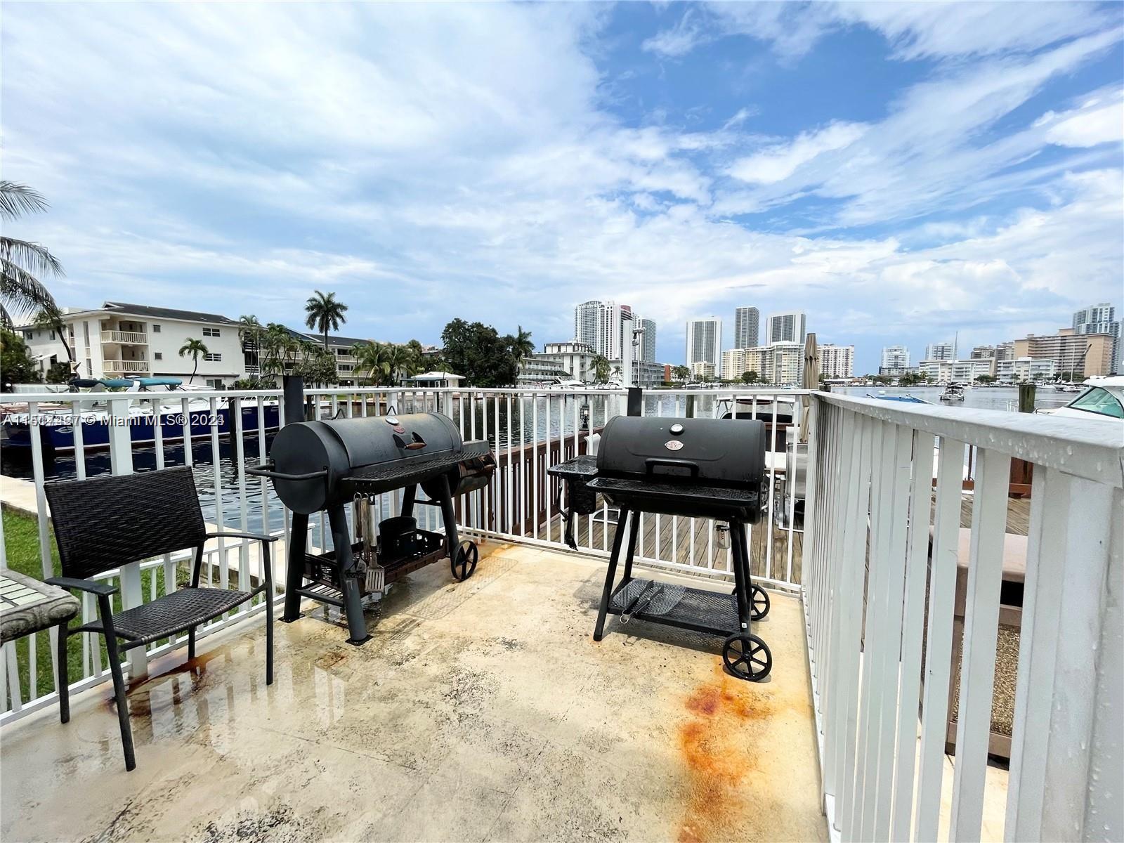 462 Golden Isles Drive, Unit 210 Hallandale Beach, FL 33009 - Photo 9 of 41 a view of a terrace with chairs