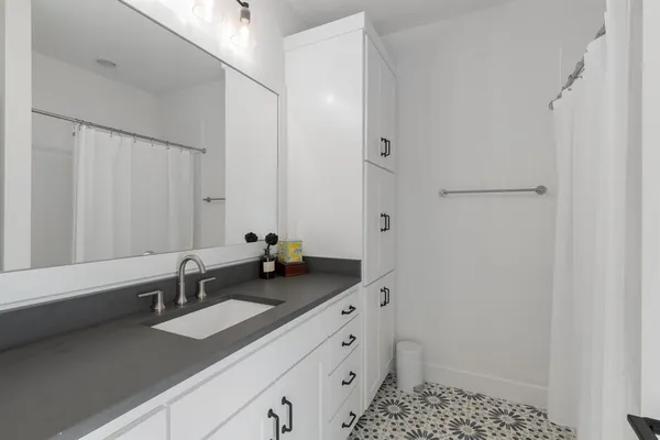 a bathroom with a sink and a mirror