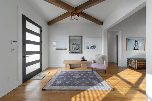 a living room with furniture or couch and a wooden floor