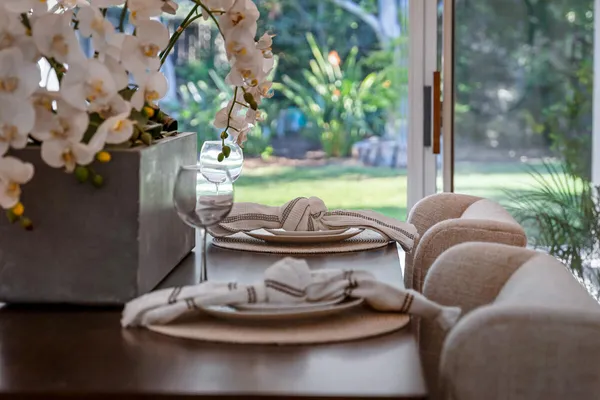a view of a porch with furniture and a yard