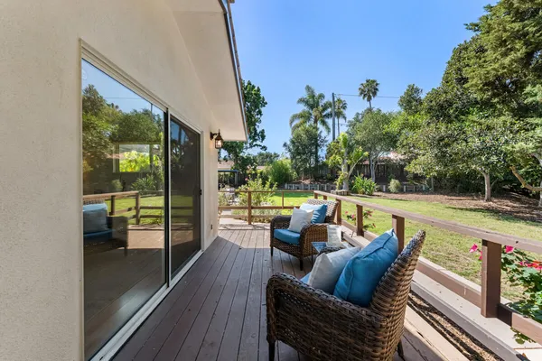 a view of deck with furniture and a potted plant